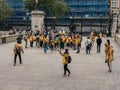 Tour group in gold jackets gather outside British Museum,, Londo