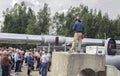 Tour Group Listens to Spiel at Epicenter of Alaska Pipeline