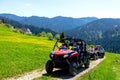 A tour group travels on ATVs and UTVs on the mountains Royalty Free Stock Photo