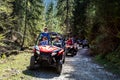 A tour group travels on ATVs and UTVs on the mountains Royalty Free Stock Photo