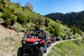 A tour group travels on ATVs and UTVs on the mountains Royalty Free Stock Photo