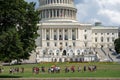 Tour groups gather on the front lawn of the US Capitol Building