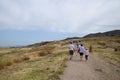 Tour groups on the ruins of Hierapolis. Tourists are shown the ruins of the ancient city