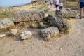 Tour groups on the ruins of Hierapolis. Tourists are shown the ruins of the ancient city