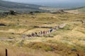 Tour groups on the ruins of Hierapolis. Tourists are shown the ruins of the ancient city