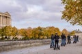 Tour groups of tourists on the streets of Paris by Segway