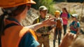 A tour guide pointing out different types of building materials to the curious students explaining the importance of