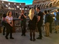 Tour guides and tourists at the Colosseum, Rome, Italy