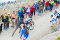 Tour of Italy: supporter pushing cyclist on mountain road Royalty Free Stock Photo