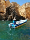 A tour operator exploring the stunning rock formations along the coast of Lagos,Portugal