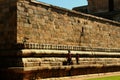 Tour people walks near main wall in the ancient Brihadisvara Temple in Gangaikonda Cholapuram, india.