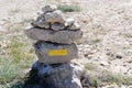 Tour trail path sign on stones pyramid for hiking in mountain pathway Royalty Free Stock Photo