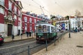 Tour tram on the streets of Alfama, Lisbon`s oldest and most traditional neighborhood. Royalty Free Stock Photo