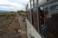 Tour van on a dirt road in rural Kenya Royalty Free Stock Photo