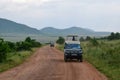 A tour van in Savannah Grassland in Masai Mara, Kenya