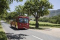 Tourbus driving alongside a vineyard in Constantia near Cape Town Southern Africa