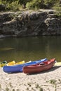 Touring canoes on river bank Royalty Free Stock Photo