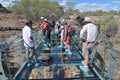 Tourist group cross over a bridge Cobbold Gorge Queensland Australia