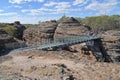 Tourist group cross over a bridge Cobbold Gorge Queensland Australia