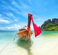 Tourism in Asia. Tropical island and tourist boat on exotic beach