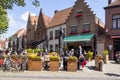 Tourism in Belgium. Medieval houses, cafes with tourists, bicycles