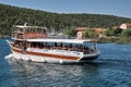 Tourism boat with people sailing on the water near Krka National Park, Croatia