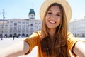 Tourism in Europe. Self portrait of smiling young tourist woman visiting Trieste, Italy Royalty Free Stock Photo