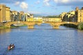 Tourists visiting Florence city with boat over the river Arno , Italy Royalty Free Stock Photo