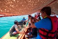 2019-04-17 Tourism Group Interesting Small Fisherman Boat in the Sea to Catch a Squid. Ranong Province, Thailand