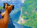 Tourist taking photo of fjord landscape, Norway Royalty Free Stock Photo