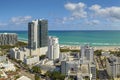 Tourism infrastructure in southern USA. South Beach sandy surface with tourists relaxing on hot Florida sun. Miami Beach Royalty Free Stock Photo