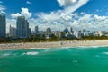 Tourism infrastructure in southern USA. South Beach sandy surface with tourists relaxing on hot Florida sun. Miami Beach Royalty Free Stock Photo