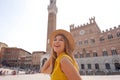Tourism in Italy. Attractive young woman visiting Siena historic town of Tuscany, Italy