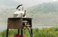 Tourism, an old kettle is heated on a rusty gas burner Royalty Free Stock Photo