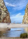 tourists relax at cala sa calobra beach in mallorca spain