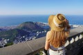 Tourism in Rio de Janeiro, Brazil. Traveler girl on Corcovado mountain looks cityscape of Rio de Janeiro, Brazil