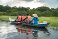 Tourism rowing boat in cajuput forest in floating water season in Mekong delta, Vietnam