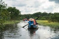 Tourism rowing boat in cajuput forest in floating water season in Mekong delta, Vietnam