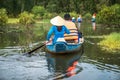 Tourism rowing boat in cajuput forest in floating water season in Mekong delta, Vietnam