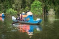 Tourism rowing boat in cajuput forest in floating water season in Mekong delta, Vietnam