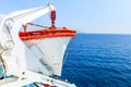 Tourism ship. Detail of the lifeboat, in the open sea, deep blue color.