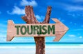 Tourism sign with a beach on background Royalty Free Stock Photo