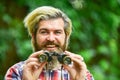 Tourism summer vacation. Observing nature. Guy explore environment. Man ornithology expedition in forest. Man observing Royalty Free Stock Photo