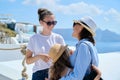 Tourism, travel, Greece, Santorini. Happy travelers mom and daughters Royalty Free Stock Photo