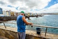 Fisherman catches fish