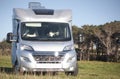 Tourism vacation and travel. Camper van parked in a meadow