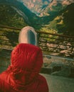 Tourist looking through binoculars in mountains, Norway