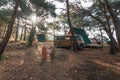 Tourism vacation and travel. Old colorful retro camper on camping site at beautiful rocky coastal landscape of