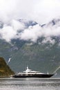 Tourism vacation and travel. Small yacht with mountains and fjord NÃÂ¦rÃÂ¸yfjord in Gudvangen, Norway, Scandinavia