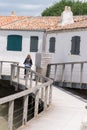 Tourism young woman ride bike at seaside vacation on ile de Re island in France